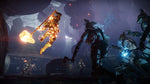 Scene from Destiny 2: Forsaken - Legendary Collection showing an Action-packed scene from a video game with characters in a dark, sci-fi environment.