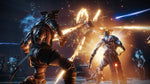 Scene from Destiny 2: Forsaken - Legendary Collection showing two characters in futuristic armor engaged in combat with glowing weapons on a dark background.