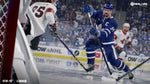 Hockey player in blue jersey with 'NHL 20' logo on screen