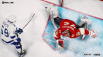 Two hockey players in action on an ice rink with NHL 23 branding.