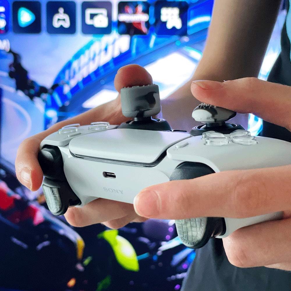 Person holding a gaming controller with a blurred game interface in the background with IMP Tech Trigger Treadz Combat Elite Trigger Grips + Thumb Grips - Urban Camo for PlayStation 5 controllers.