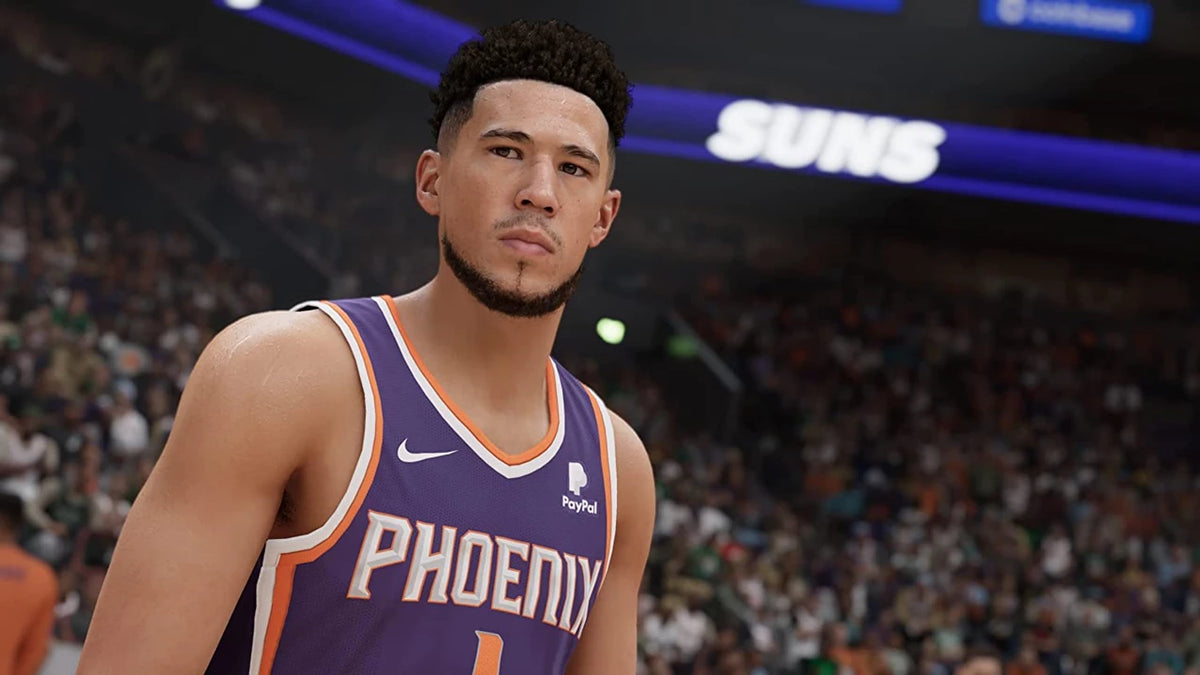 Basketball player in a Phoenix Suns jersey on a basketball court with crowd in the background. From the game NBA 2K23 for PlayStation 5.