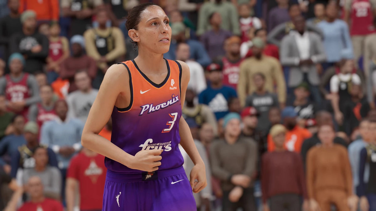 Basketball player in a purple and orange uniform with 'Phoenix' on it, standing in front of a crowd. From the game NBA 2K23 for PlayStation 5.