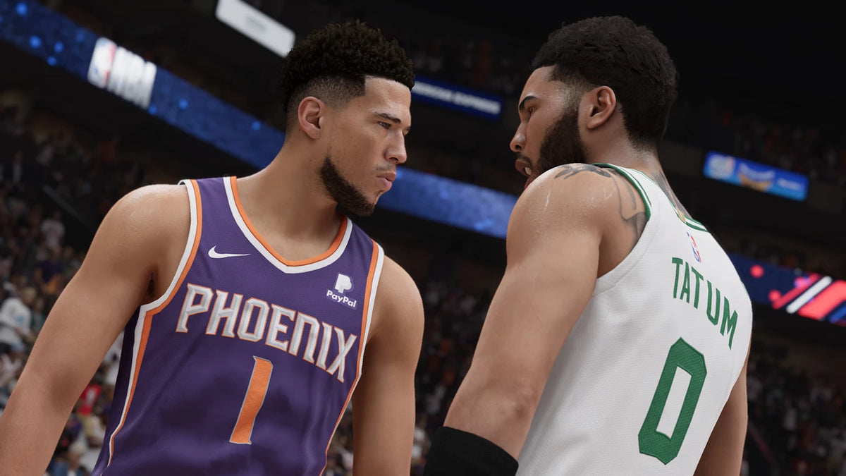 Two basketball players from Phoenix and Boston facing each other on a court. From the game NBA 2K23 for PlayStation 5.