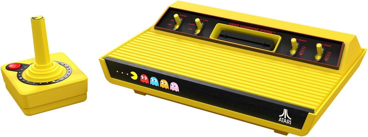 Atari 2600+ Pac-Man Edition retro console shown with the yellow CX40+ wireless joystick, featuring the classic Atari design with distinctive Pac-Man yellow detailing.