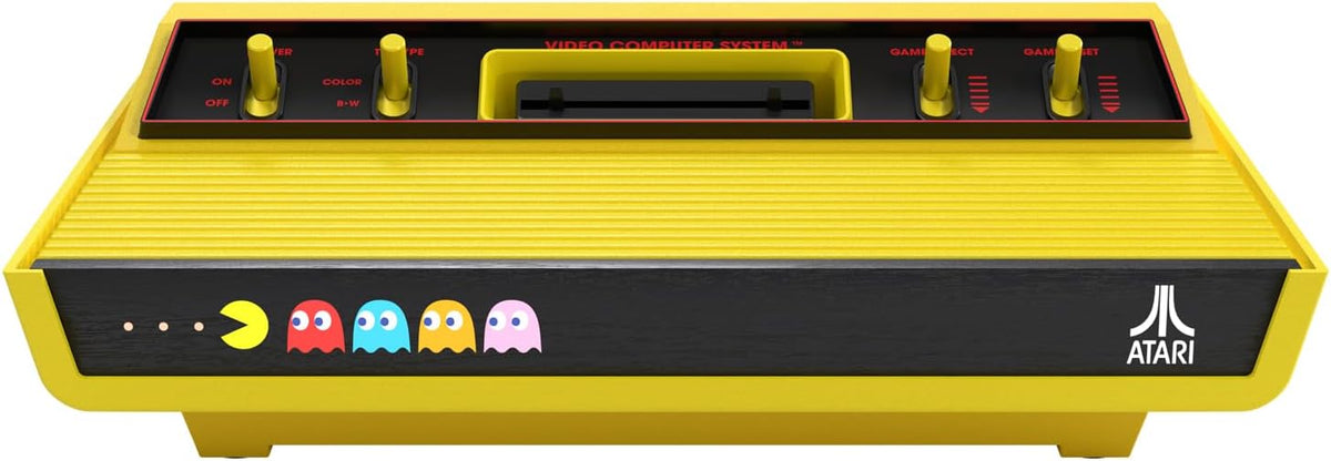 Atari 2600+ Pac-Man Edition retro gaming console shown from the front, highlighting the black casing, yellow trim, cartridge slot and classic Atari control switches.