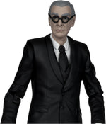 Close-up of the McFarlane Batman Forever Alfred Pennyworth action figure in black suit and glasses