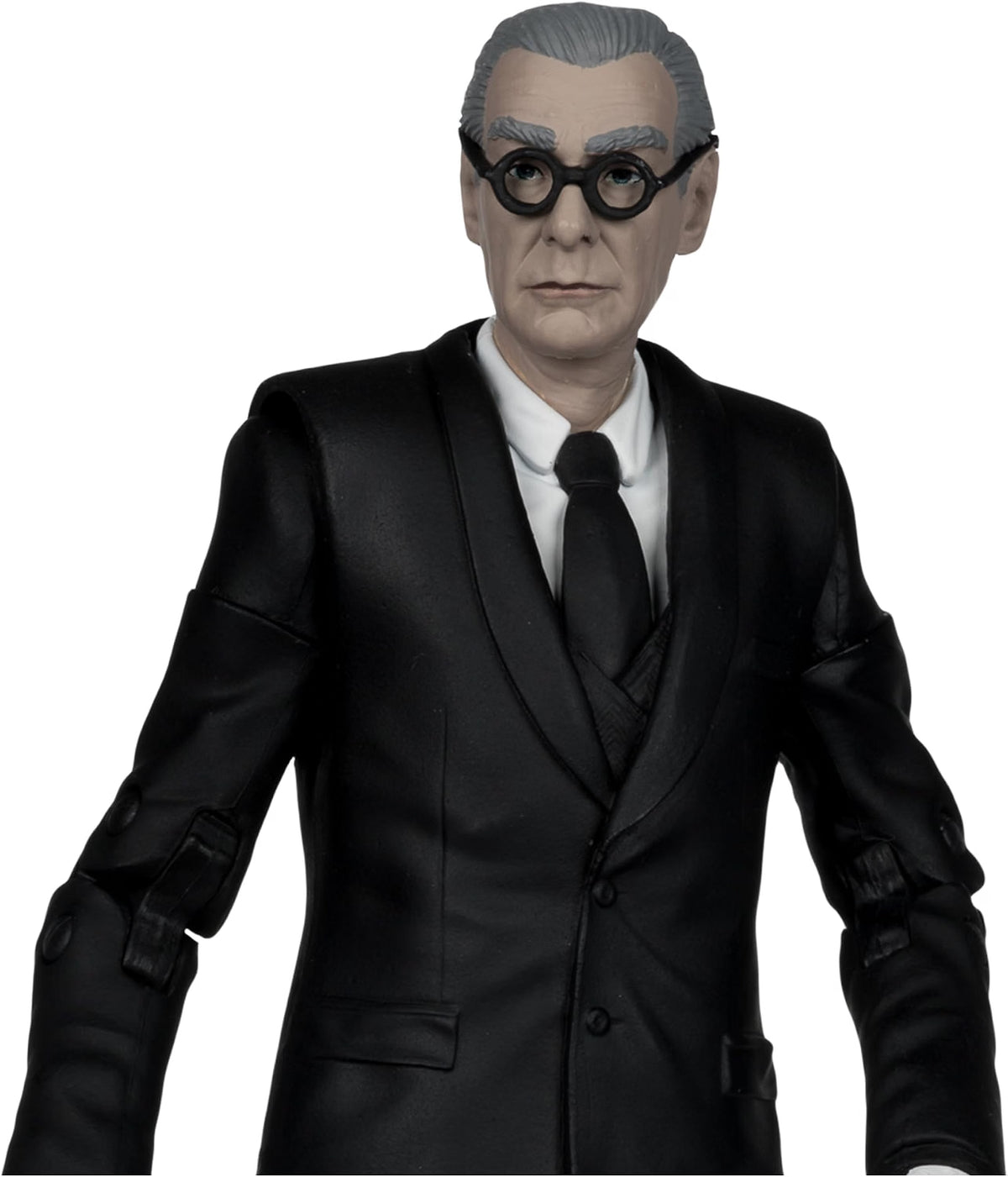 Close-up of the McFarlane Batman Forever Alfred Pennyworth action figure in black suit and glasses
