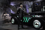 Alfred Pennyworth action figure standing beside the McFarlane Batman Forever Batmobile