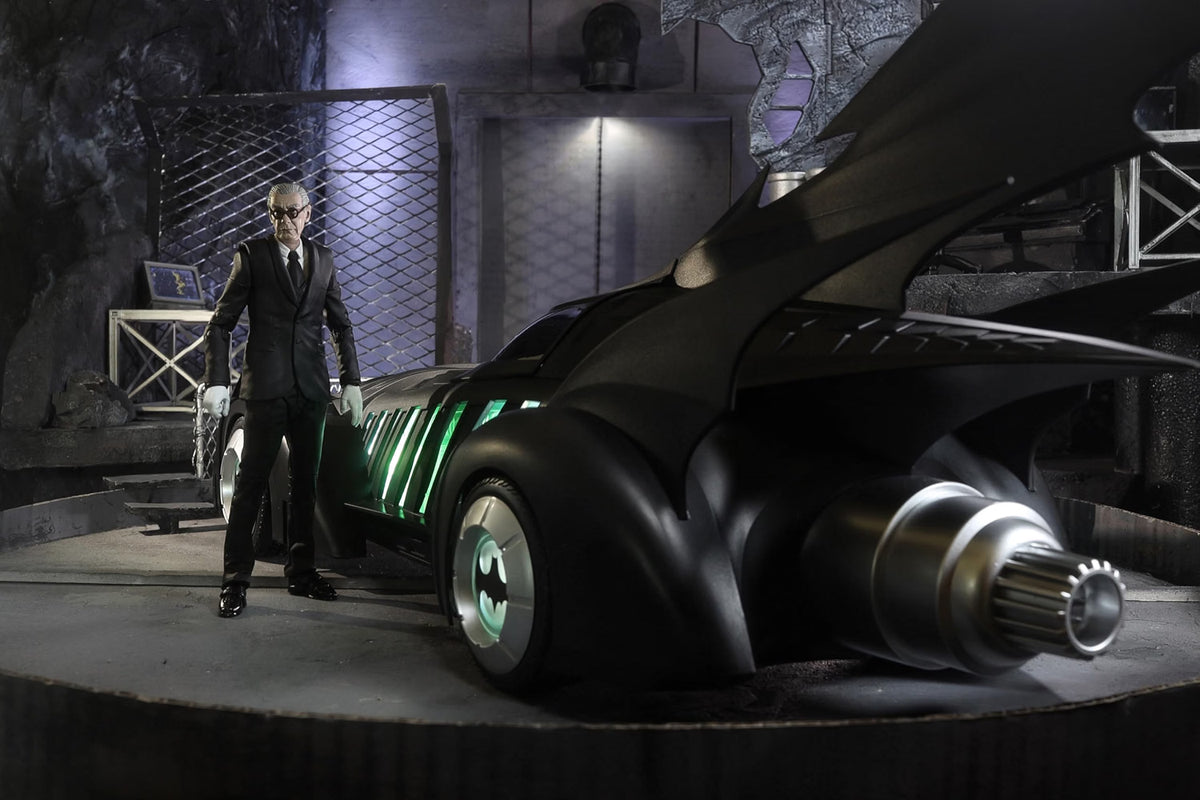 Batman Forever Batmobile and Alfred Pennyworth figure displayed in a Batcave-style scene