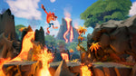 Crash Bandicoot 4 It's About Time Nintendo Switch gameplay showing Crash jumping through a fiery outdoor level with dangerous obstacles.