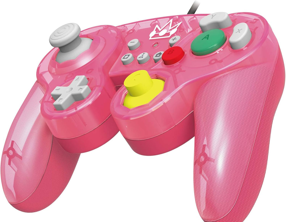 HORI Battle Pad Princess Peach Nintendo Switch controller shown at a three-quarter angle, highlighting the pink casing, ergonomic grips, yellow C-stick and green A button.