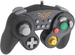 HORI Battle Pad The Legend of Zelda wired controller viewed from a raised angle, showing the black GameCube-inspired casing, gold Zelda emblem and distinctive button arrangement.