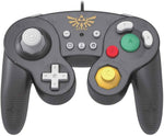 Front view of the HORI Zelda Battle Pad wired Nintendo Switch controller, featuring a GameCube-style button layout, grey D-pad, yellow C-stick and gold Hylian Crest.