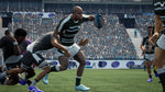 Jonah Lomu Rugby Challenge 4 Nintendo Switch gameplay featuring a rugby player sprinting with the ball past opposing players in a packed stadium.