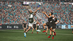 Jonah Lomu Rugby Challenge 4 Nintendo Switch gameplay showing rugby players jumping and reaching for the ball during a match in a crowded stadium.