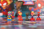 Marvel Race Home 3D playing pieces including Thanos, Iron Man, Groot, Captain Marvel and Spider-Man
