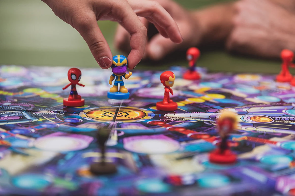 Marvel Race Home board game being played with Thanos, Spider-Man and Iron Man 3D pieces