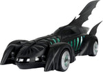 Front angled view of the McFarlane Batman Forever Batmobile showing its black body, bat fins and green illuminated details
