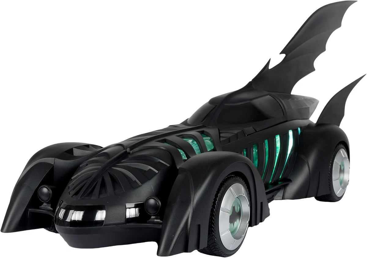 Front angled view of the McFarlane Batman Forever Batmobile showing its black body, bat fins and green illuminated details