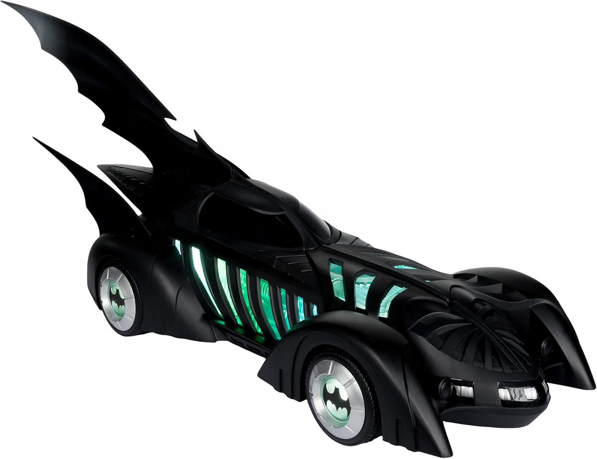 McFarlane Batman Forever Batmobile shown from an angled view with illuminated green side details and large bat fins