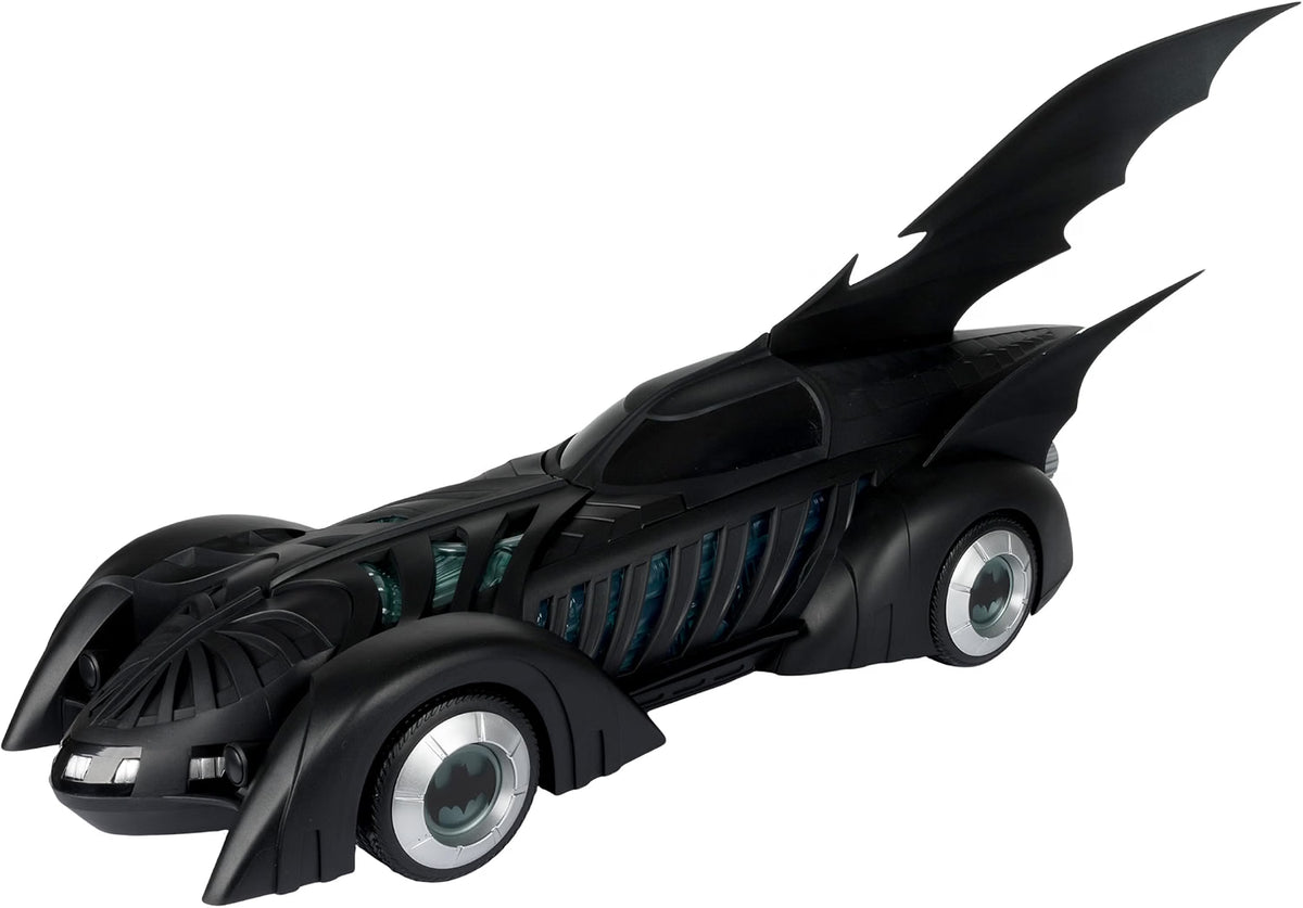 Side profile of the McFarlane Batman Forever Batmobile showing its long black body, bat fins and Batman wheel emblems