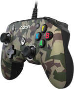 Nacon Pro Compact Forest Camo wired Xbox controller shown at an angle, highlighting its green and brown camouflage design, ergonomic grips and compact button layout.