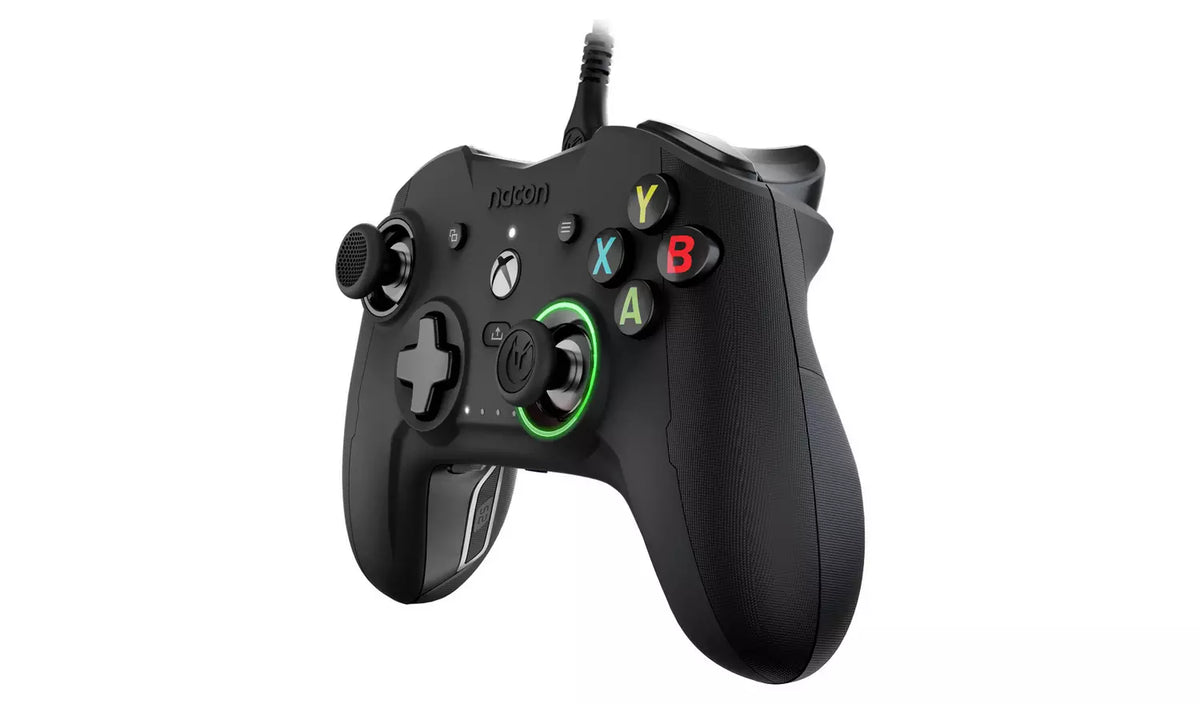 Nacon Revolution X Pro Wired Controller shown at a three-quarter angle, featuring black textured grips, green analogue stick accents and familiar Xbox button layout.