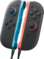 Nintendo Switch 2 Joy-Con 2 controllers in Light Blue and Light Red attached to the console, showing their magnetic connection and contrasting colour accents.