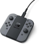Nintendo Switch Joy-Con Charging Stand Two-Way shown with compatible grey NES wireless controllers, demonstrating the stand's additional charging functionality.