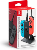 Official Nintendo Switch Joy-Con Charging Stand Two-Way in retail packaging, showing the black charging stand with Neon Blue and Neon Red Joy-Con controllers.