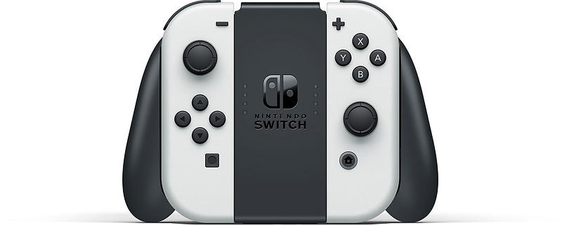 Nintendo Switch OLED White Joy-Con controllers attached to the official Joy-Con Grip, showing the analogue sticks, gaming buttons and black grip handles.
