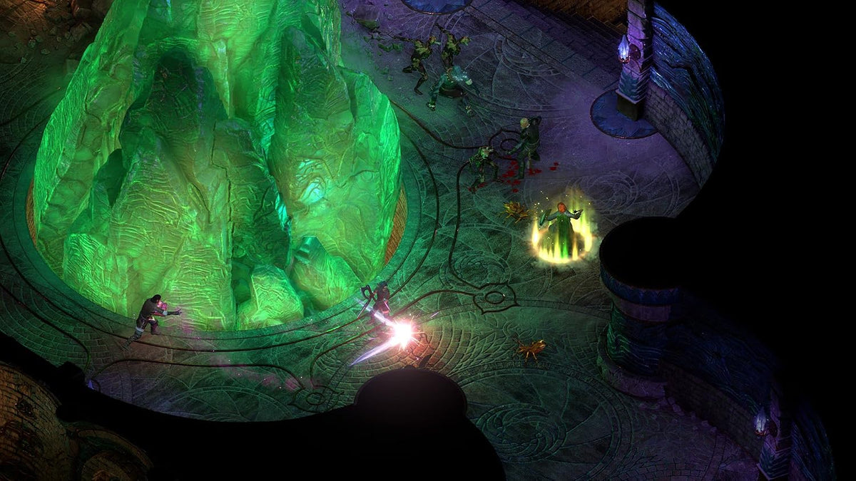 Pillars of Eternity II Deadfire Xbox One gameplay featuring characters exploring a mysterious underground cavern illuminated by glowing green magical crystals.