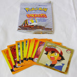 Pokémon Artbox Series 1 sticker pack displayed with a selection of collectible Pokémon stickers