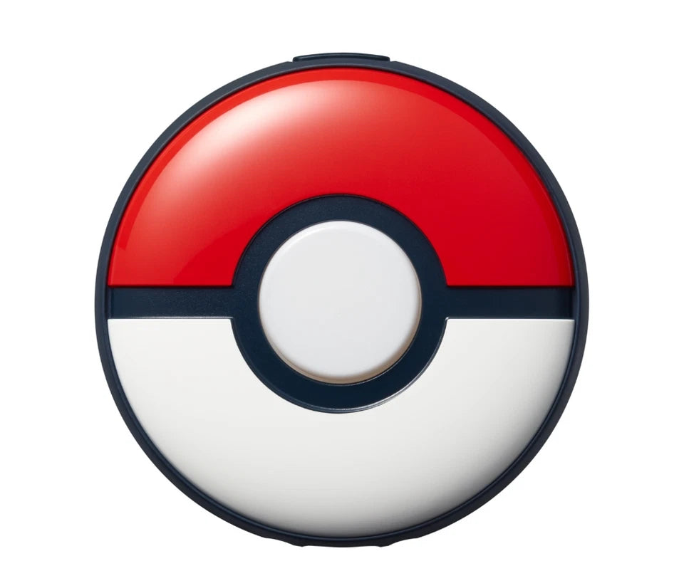 Pokémon GO Plus + Bluetooth accessory shown from the front, featuring its red and white Poké Ball design, central illuminated button and black detailing.