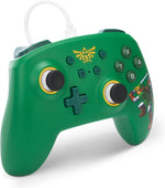 PowerA The Legend of Zelda Hyrule Defender Wired Controller shown at an angle, highlighting its green finish, gold detailing, Zelda character artwork and ergonomic design.