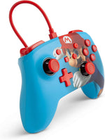 PowerA Mario Punch Enhanced Wired Nintendo Switch Controller shown at an angle, highlighting the colourful Super Mario design, red analogue sticks and ergonomic blue grips.