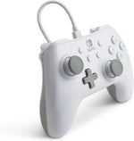 PowerA White Wired Nintendo Switch Controller shown from a three-quarter angle, highlighting its ergonomic design, grey thumbsticks, white casing and detachable USB cable.