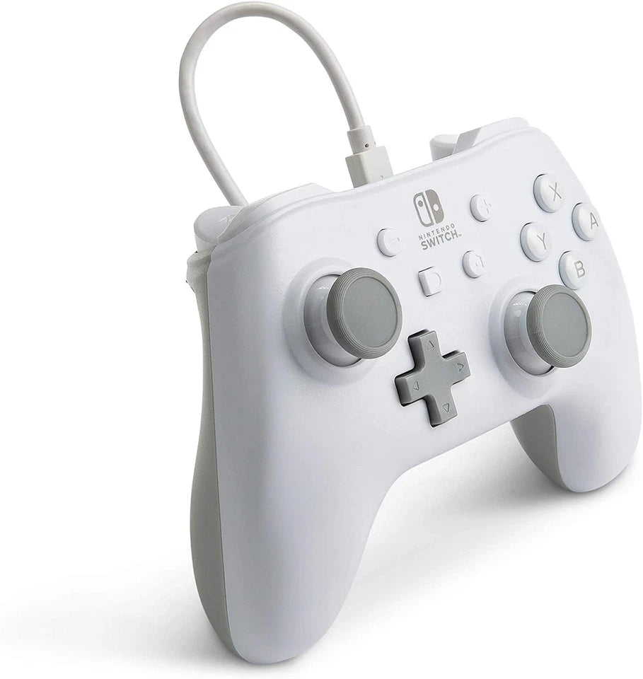 PowerA White Wired Nintendo Switch Controller shown from a three-quarter angle, highlighting its ergonomic design, grey thumbsticks, white casing and detachable USB cable.