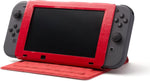 PowerA Super Mario Hybrid Cover and Stand supporting a Nintendo Switch console in tabletop mode, showing the red folding stand and adjustable viewing position.