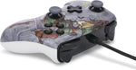 Low-angle view of the PowerA Zelda Valiant Link wired Nintendo Switch controller, highlighting the decorated front casing, analogue sticks, face buttons and connected USB cable.