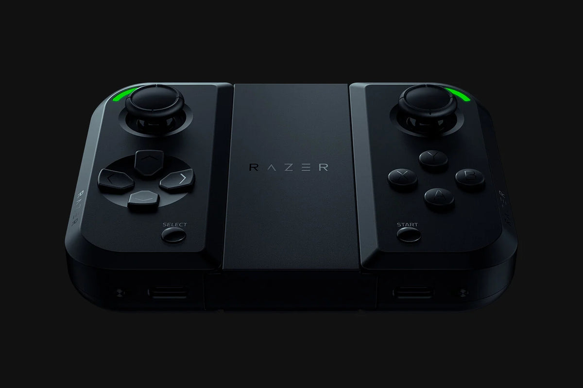Razer Junglecat dual-sided wireless controller in black, featuring detachable gaming controls, a central grip and green illuminated accents.