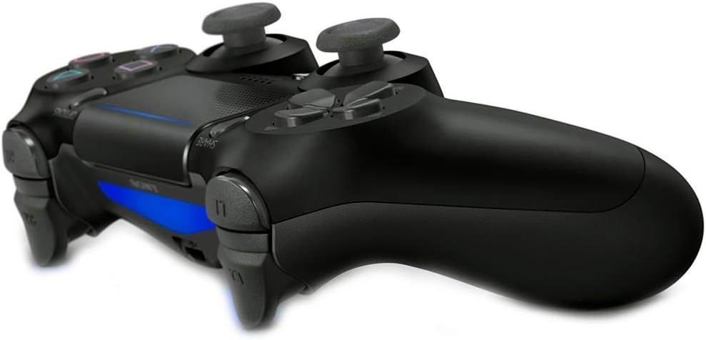 Official Sony DualShock 4 Jet Black PS4 wireless controller shown at an angle, highlighting its ergonomic shape, textured grips, analogue sticks and black finish.