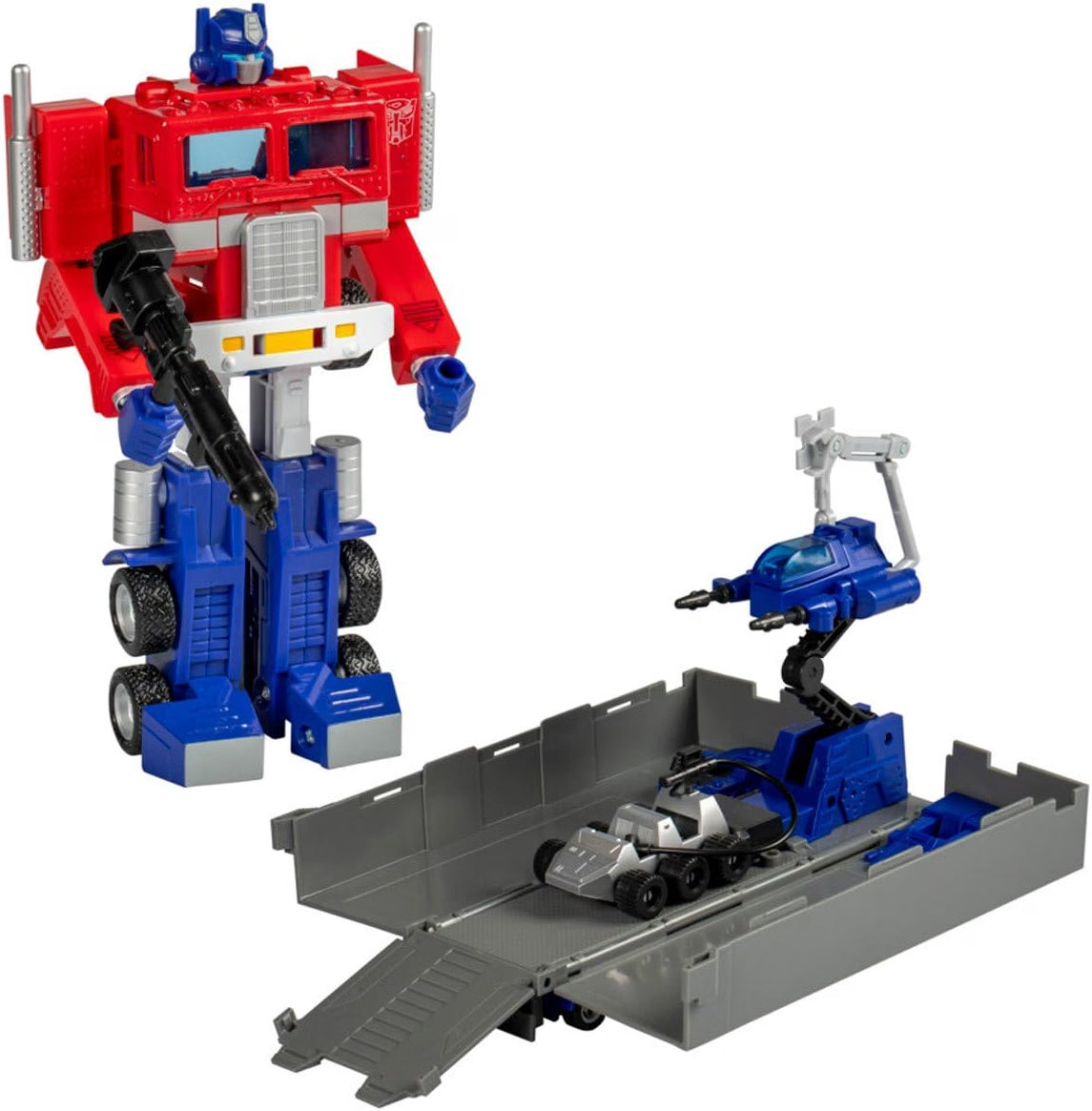 Transformers G1 Optimus Prime 40th Anniversary figure in robot mode with opened trailer, Roller and accessories