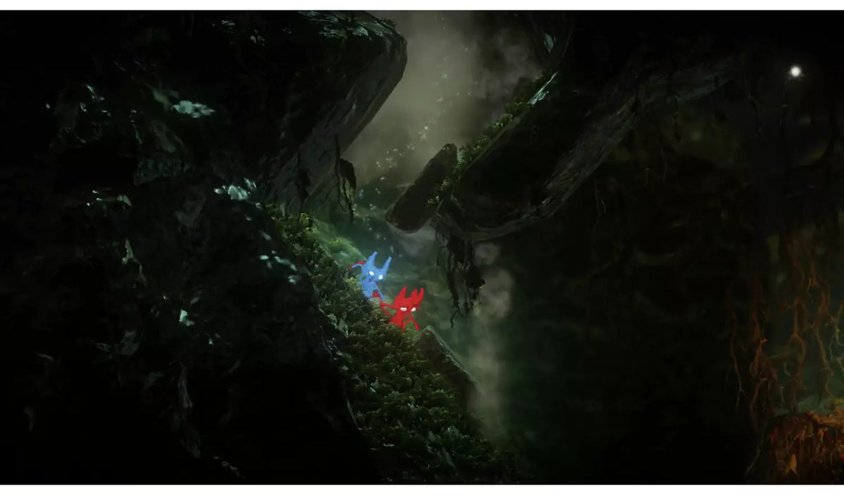Unravel Two Nintendo Switch gameplay featuring the two Yarny characters navigating a dark cave environment