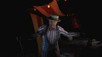 Until Dawn Rush of Blood PSVR screenshot showing a sinister carnival character wearing a striped costume and top hat inside a dark fairground attraction.