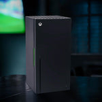 Xbox Series X replica drinks cooler standing on a desk in a dimly lit gaming setup